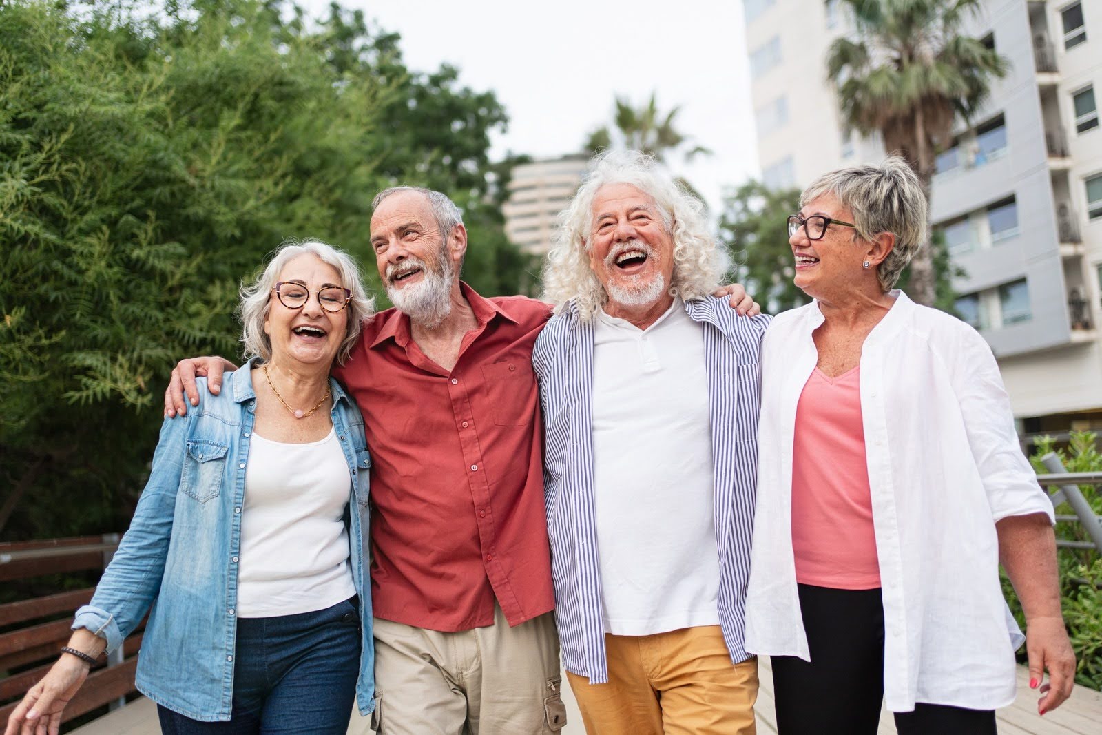 Group of senior friends walking together, bonding outdoors, enjoying friendship, retirement, and happy lifestyle